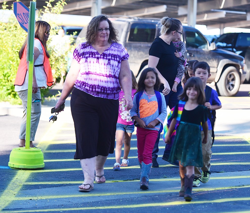 Busy morning in the crosswalk for the first day of school at Territorial Elementary School in Chino Valley Tuesday, August 8. (Les Stukenberg/The Daily Courier).