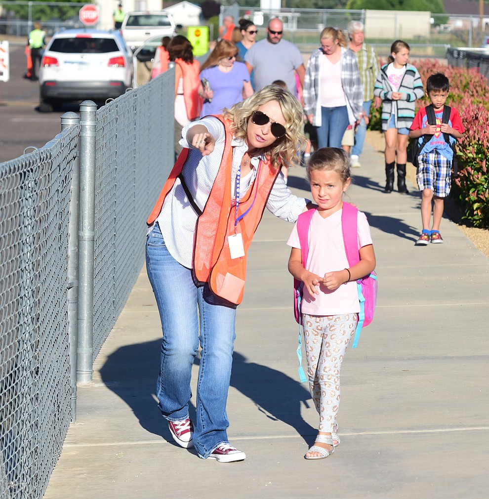 Librarian Velmarie Foster helps Avianna Favela find her way on the first day of school at Territorial Elementary School in Chino Valley Tuesday, August 8. (Les Stukenberg/The Daily Courier).