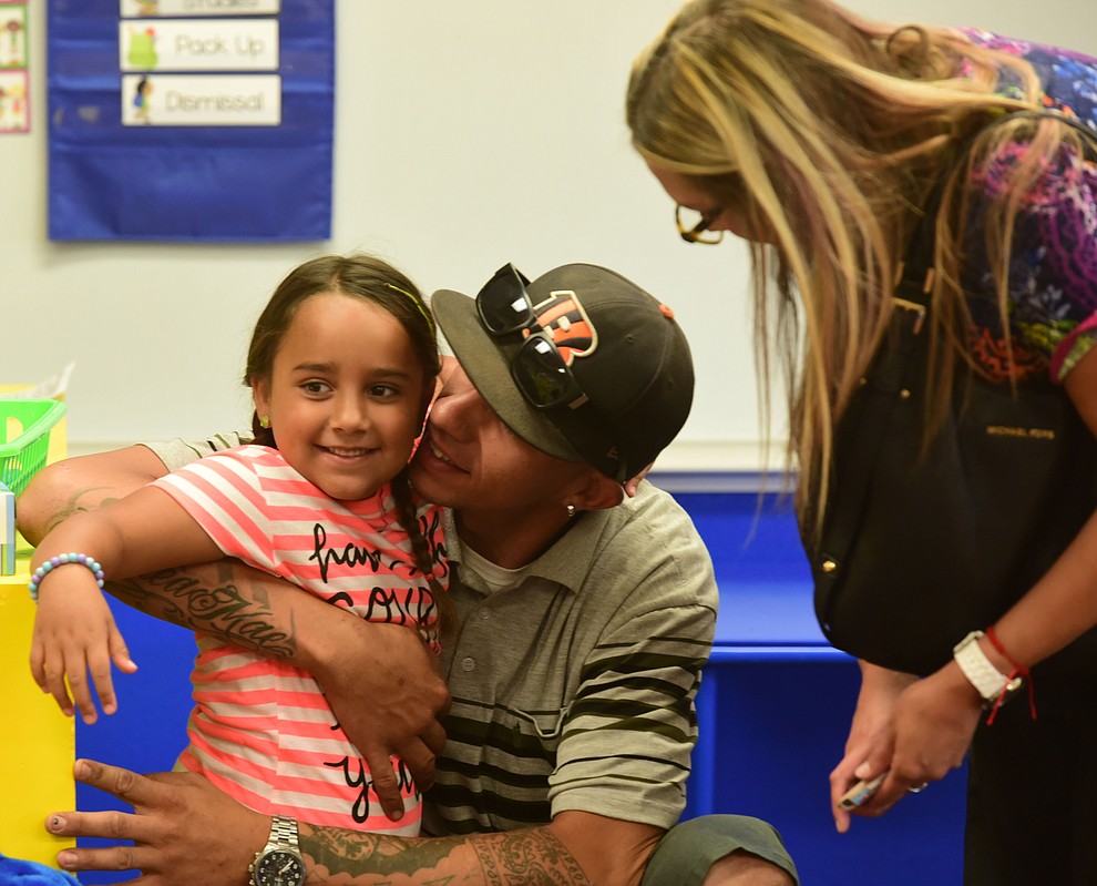 Peter Alaniz  and Brittany Hofeld say goodbye to their daughter Khloe in kindergarten at Territorial Elementary School in Chino Valley Tuesday, August 8. (Les Stukenberg/The Daily Courier).