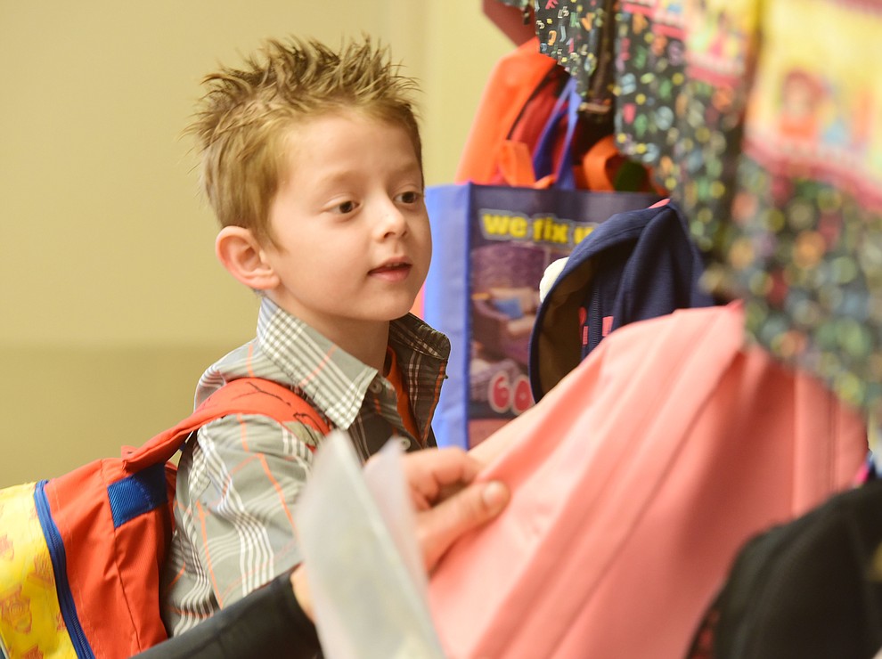 Kayden Ivie looks for his backpack hook at Territorial Elementary School in Chino Valley Tuesday, August 8. (Les Stukenberg/The Daily Courier).