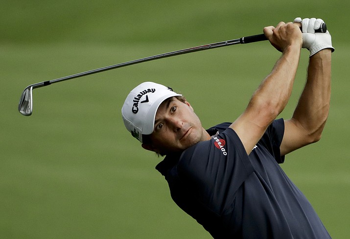 Kevin Kisner hits from the fairway on the 18th hole during the first round of the PGA Championship at the Quail Hollow Club on Thursday, Aug. 10, 2017, in Charlotte, N.C. (Chris O’Meara/AP)