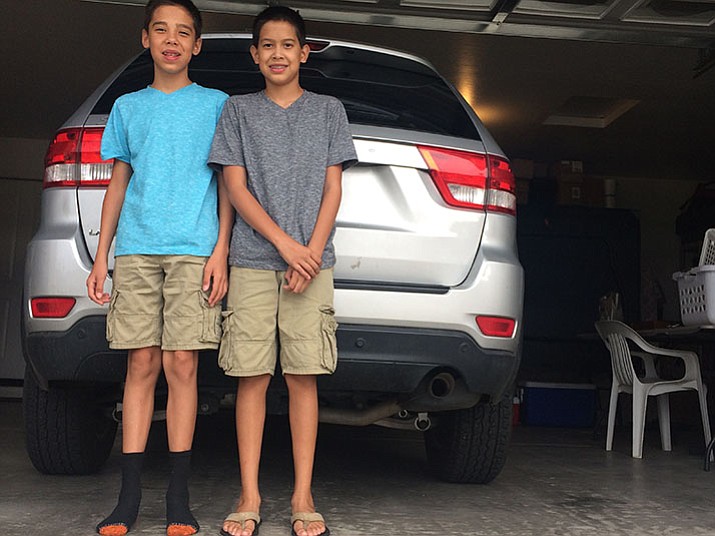 Patrick and Wyatt Eyler saved their granduncle’s life by lifting the car they were helping him to restore off his chest when it collapsed and pinned him to the floor. (Jason Wheeler/Courier)