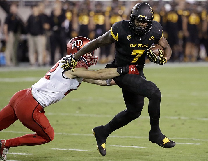 In this Nov. 10, 2016, file photo, Arizona State running back Kalen Ballage (7) sheds a tackle during the first half in Tempe. (Matt York/AP, File)