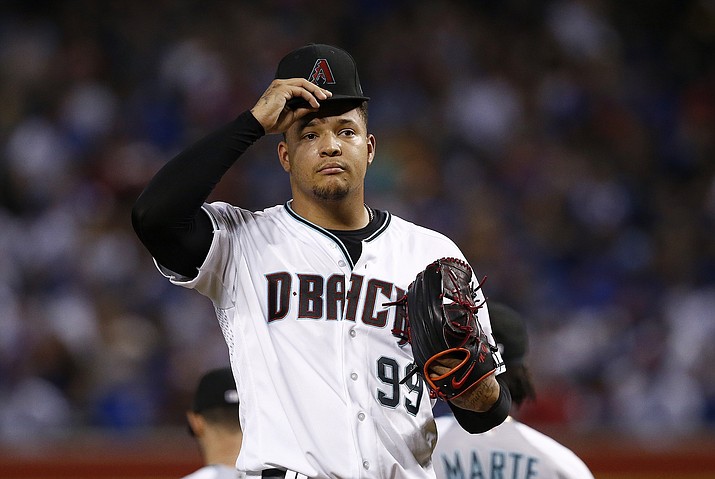 Arizona Diamondbacks' Taijuan Walker pauses on the mound after giving up two runs to the Chicago Cubs during the first inning of a baseball game Friday, Aug 11, 2017, in Phoenix. (Ross D. Franklin/AP)