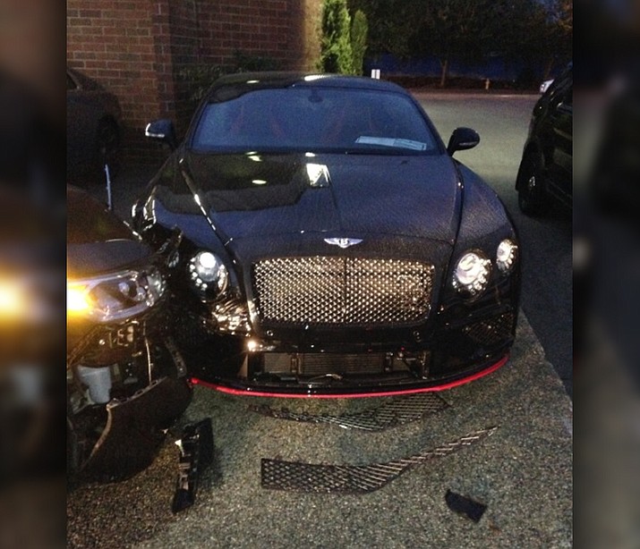 Police say a 32-year-old man was arrested Sunday after he allegedly rammed his car into two luxury vehicles at a Washington car dealership, causing more than $500,000 in damage to a Bentley and a Rolls-Royce. (Bellevue Police Department)