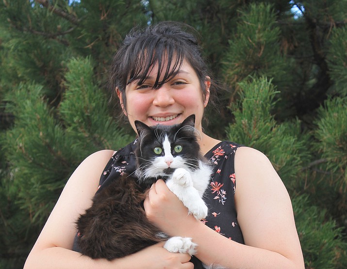 Danielle Martinez holds her cat, Sylvester, who had the honor of being the 4,000 pet spayed by Williams Animal Action Group. 