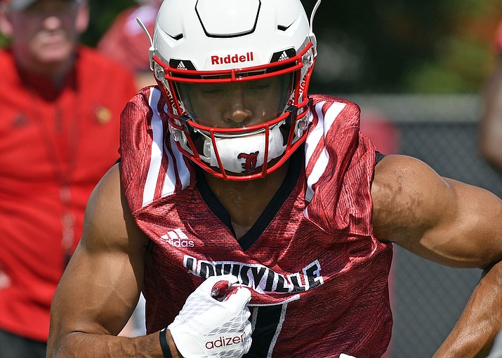 In this July 31, 2017, file photo, Louisville running back Reggie Bonnafon (7) participates in drills at the start of an NCAA college football practice, in Louisville, Ky. (Timothy D. Easley/AP, File)