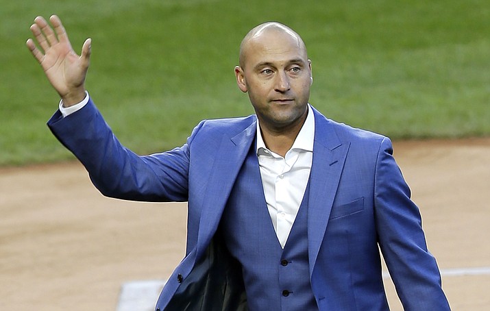 In this May 14, 2017, file photo, former New York Yankees player Derek Jeter waves to fans during a ceremony retiring his number at Yankee Stadium in New York. (Seth Wenig/AP, File)