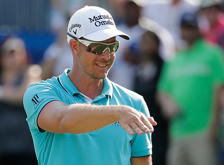 Henrik Stenson reacts to his putt on the 15th hole during the third round of the Wyndham Championship golf tournament in Greensboro, N.C., Saturday, Aug. 19. (Chuck Burton/AP)