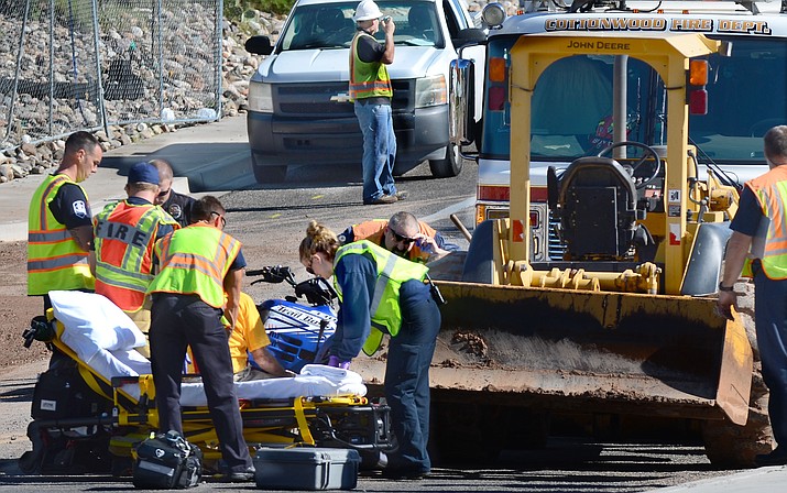 An elderly man riding an ATV was flown to Flagstaff Medical Center Thursday morning after striking a parked backhoe that had been cleaning up debris in Cottonwood. (VVN/Vyto Starinksas)