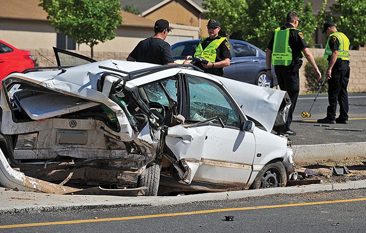 Prescott Valley police officers investigate the scene of a collision on Glassford Hill Road. (Courier, file)