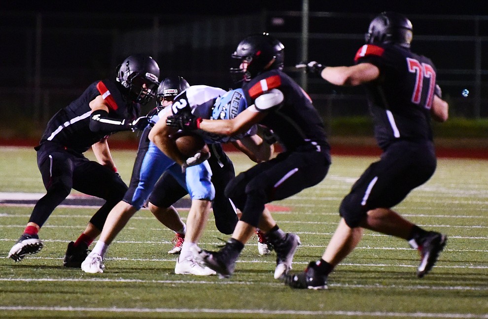 Bradshaw Mountain's defenders tackle a runner as the Bears take on the Cactus Cobras in Prescott Valley Friday, August 25. (Les Stukenberg/The Daily Courier).