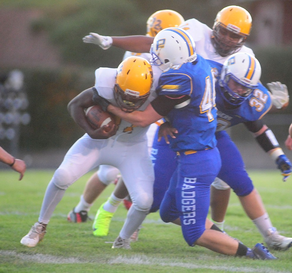 Prescott's Jacob Gathman makes a tackle as the Badgers take on the Marcos de Niza in Prescott Friday, August 25. (Les Stukenberg/The Daily Courier).
