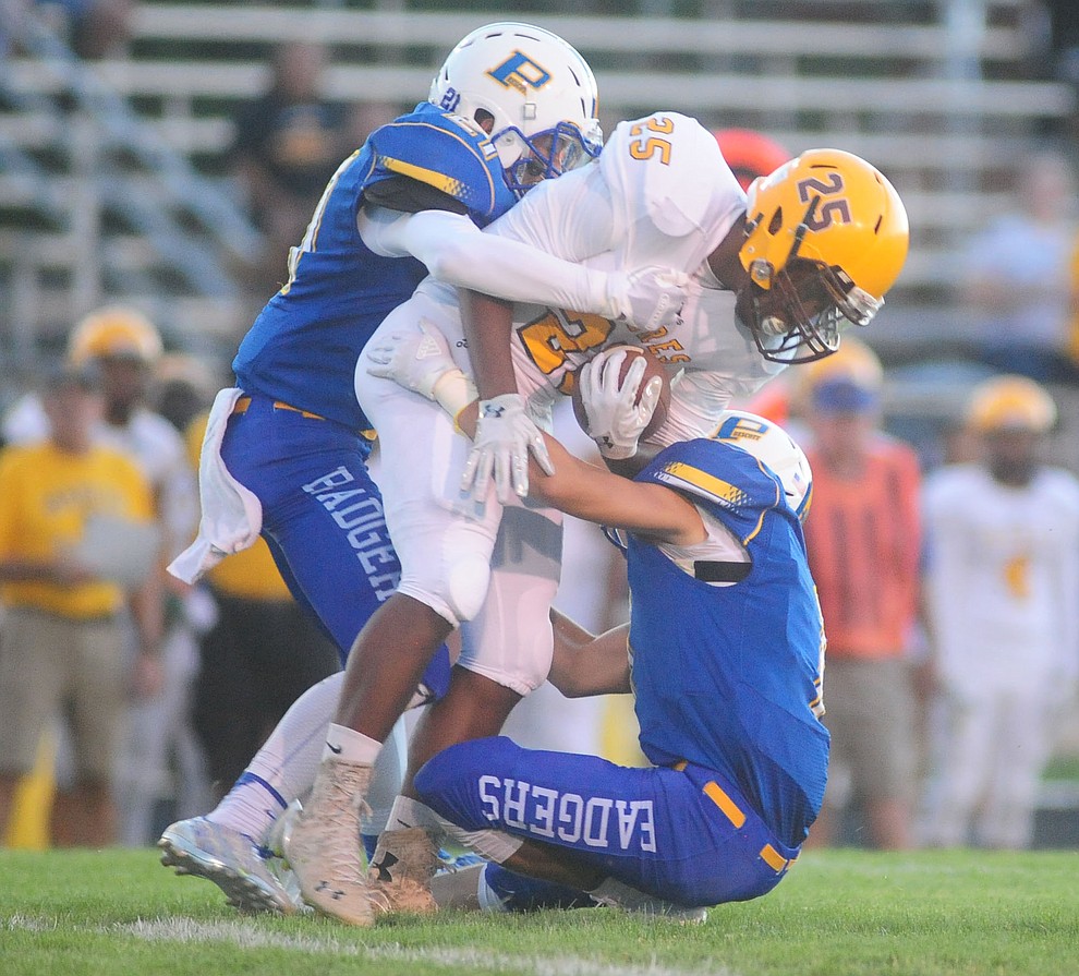 Prescott's Hunter Kronberg and Spencer Newnum make a tackle as the Badgers take on the Marcos de Niza in Prescott Friday, August 25. (Les Stukenberg/The Daily Courier).
