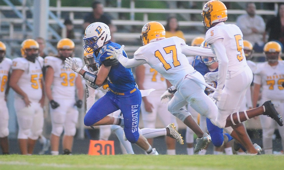 Prescott's Ryan Greene breaks free for a touchdown run as the Badgers take on the Marcos de Niza in Prescott Friday, August 25. (Les Stukenberg/The Daily Courier).