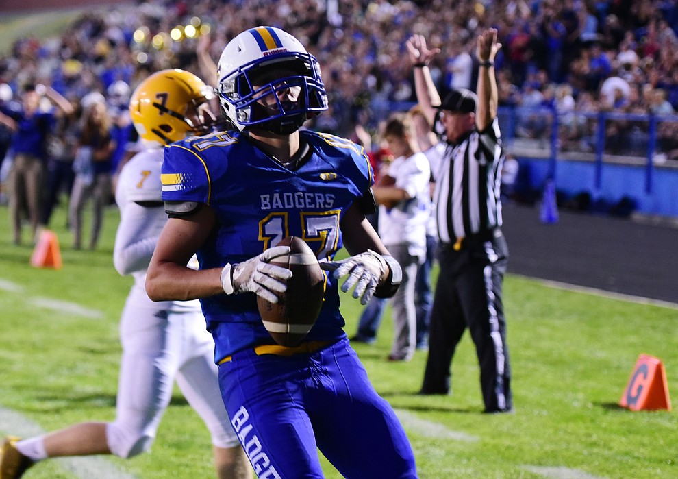 Prescott's Ryan Greene breaks free for a touchdown run as the Badgers take on the Marcos de Niza in Prescott Friday, August 25. (Les Stukenberg/The Daily Courier).