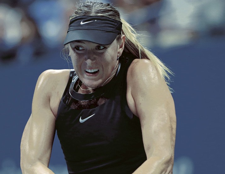 Maria Sharapova, of Russia, hits against opponent Simona Halep during the opening round of the U.S. Open on Monday, Aug. 28, 2017, in New York. (Kathy Willens/AP)