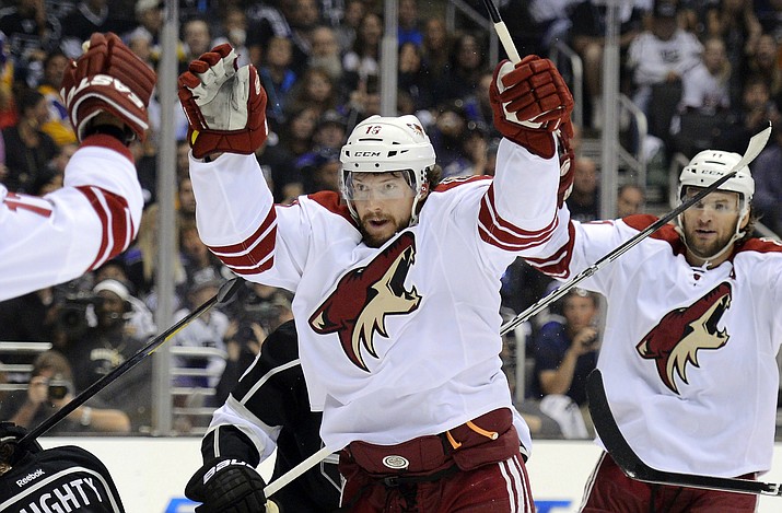 In this May 20, 2012, file photo, Phoenix Coyotes right wing Shane Doan, center, celebrates his goal with teammates during Game 4 of the NHL hockey Stanley Cup Western Conference finals, in Los Angeles. Doan is retiring after 21 seasons with the same franchise. Doan announced his retirement in a letter to Coyotes fans published in The Arizona Republic. The 40-year-old Doan is the franchise’s all-time leader in nearly every category, finishing his career with 402 goals and 570 assists in 1,540 games. (Mark J. Terrill, AP, file)