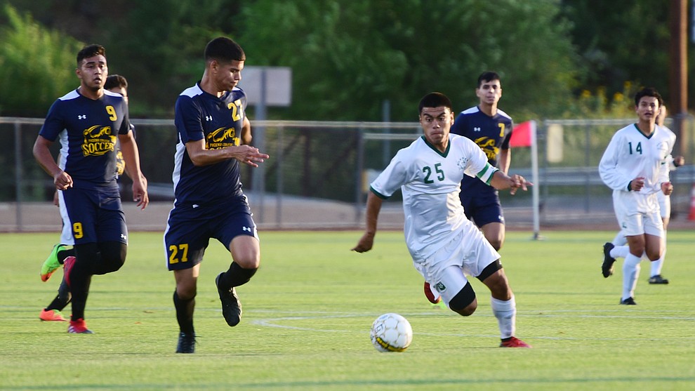 Yavapai's Jose Perez Flores drives the ball forward as the Roughriders take on the Phoenix College Bears Tuesday night at Mountain Valley Park in Prescott Valley. (Les Stukenberg/Courier).