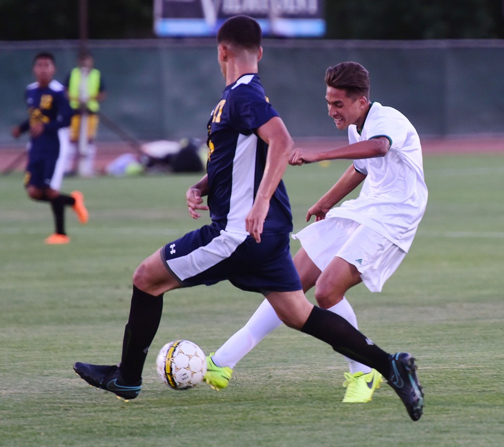 Yavapai's John Searce takes a shot on goal as the Roughriders take on the Phoenix College Bears Tuesday night at Mountain Valley Park in Prescott Valley. (Les Stukenberg/Courier).