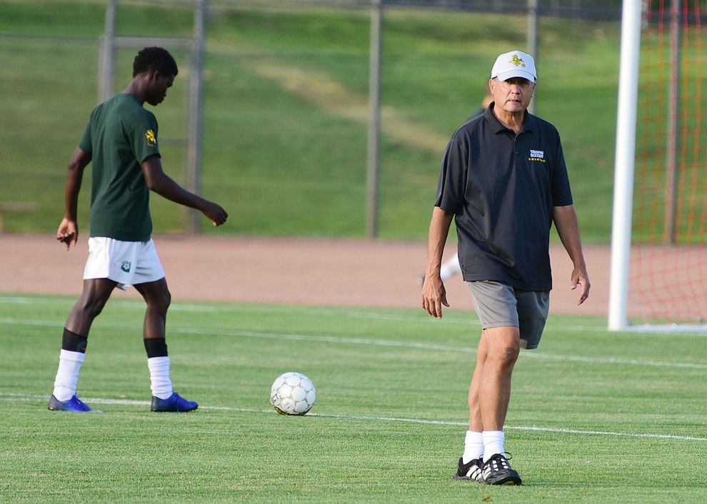 Yavapai Head Coach Mike Pantalione heads to the bench before the Roughriders take on the Phoenix College Bears Tuesday night at Mountain Valley Park in Prescott Valley. (Les Stukenberg/Courier).