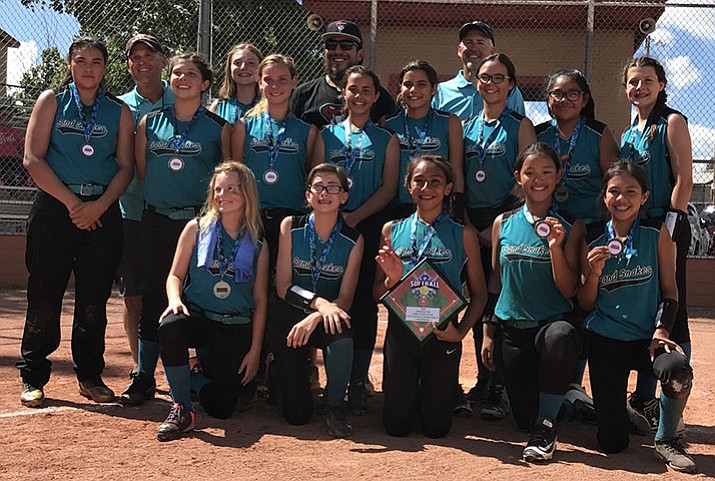 The Arizona Sand Snakes girls’ fast-pitch softball team includes, from left and kneeling in the front row, Natalie Diedrick, Kendall Murray, Yasmine Bernal, Ruby Tessman and Aleah Murillo. Sand Snakes in the back row include Saree James, assistant coach Mike Tessman, Tessa Martinez, Peyton Weber, Laycee Wasil, assistant coach Pepe Bernal, Harlee McDowell, Kiley Alvarez, head coach Bill Weber, Mia Luzania, Mercedes Jackson and Madison Vick. Madison Brown is not pictured. (Joy Tessman/Courtesy)