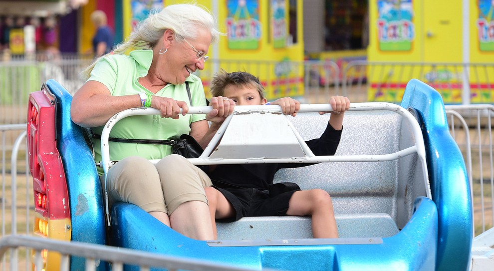 Wendy Tilman rides the Sizzler with her grandson Seth at the 2017 Yavapai County Fair at the Prescott Rodeo Grounds Wednesday, September 7 in Prescott . (Les Stukenberg/Courier).
