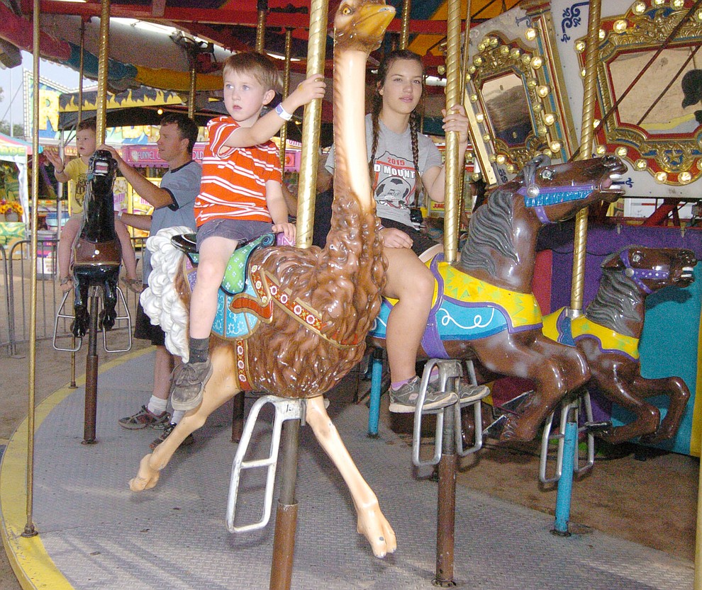 Riding the merry-go-round at the 2017 Yavapai County Fair at the Prescott Rodeo Grounds Wednesday, September 7 in Prescott . (Les Stukenberg/Courier).