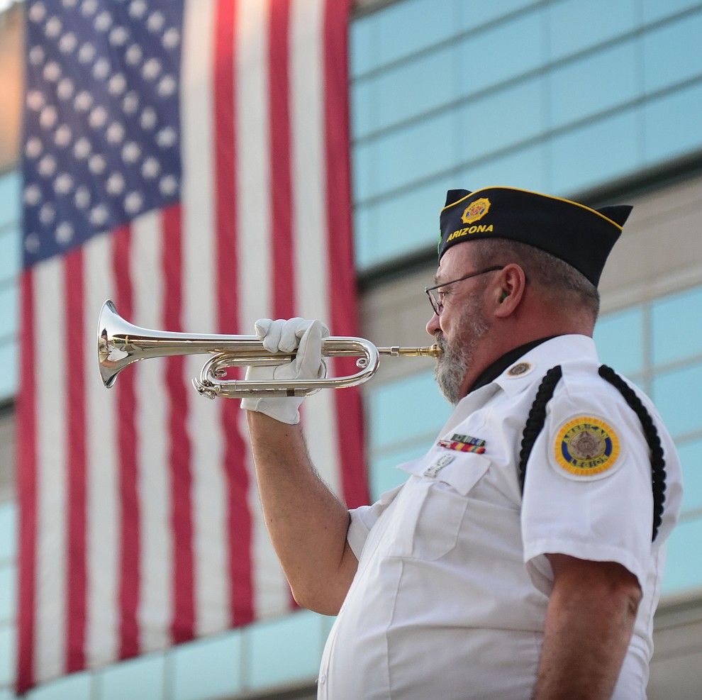 American Legion Post 135 bugler Brad Moors plays Taps during the Prescott Valley 2017 9/11 Patriot Day Ceremony at the Civic Center in Prescott Valley. (Les Stukenberg/Courier).
