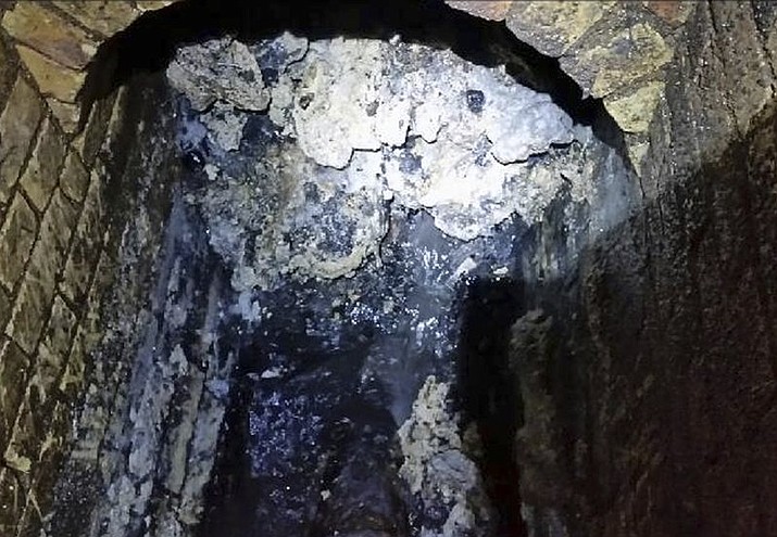 A view of a fatberg inside a sewer in Whitechapel, London. British engineers say they have launched a “sewer war” against a giant fat blob clogging London’s sewers. Thames Water officials said Tuesday it is likely to take three weeks to dissolve the outsize fatberg. (Thames Water via AP)