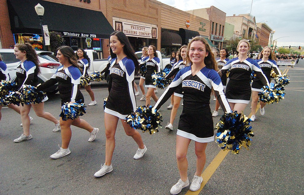 Prescott High School cheerleaders march along Montezuma Street during the annual Prescott High School Homecoming Parade and Bonfire Wednesday, September 13 through downtown Prescott. (Les Stukenberg/Courier).