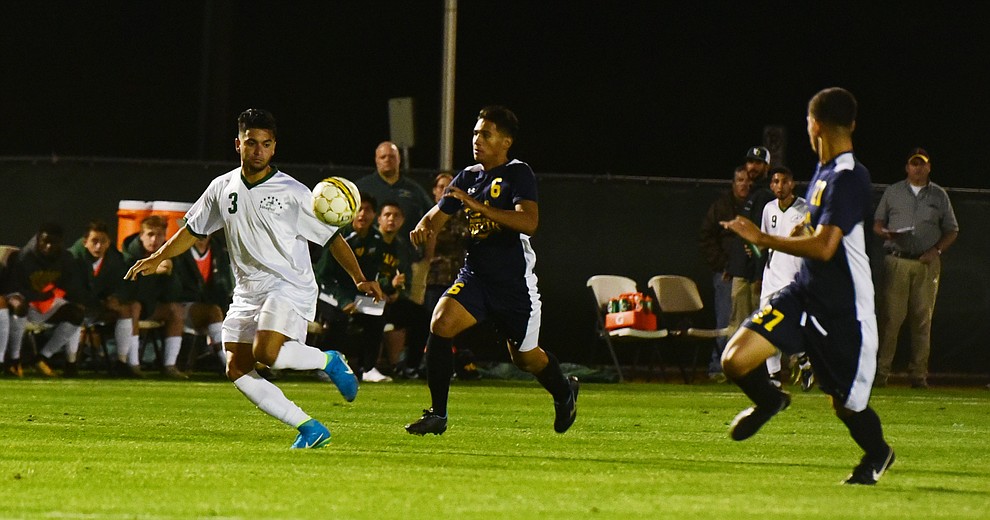 Yavapai's Ziyad Fares outruns two defenders as the Roughriders played to a 1-1 draw against Phoenix College in a makeup game Thursday, September 14 in Prescott Valley. (Les Stukenberg/Courier).
