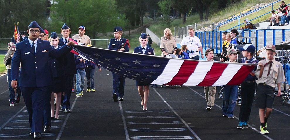Prescott's JAFROTC cadets along with Cub Scouts present the flag before the Badgers play Moon Valley in the 2017 Homecoming game Friday, September 15 in Prescott. (Les Stukenberg/Courier).