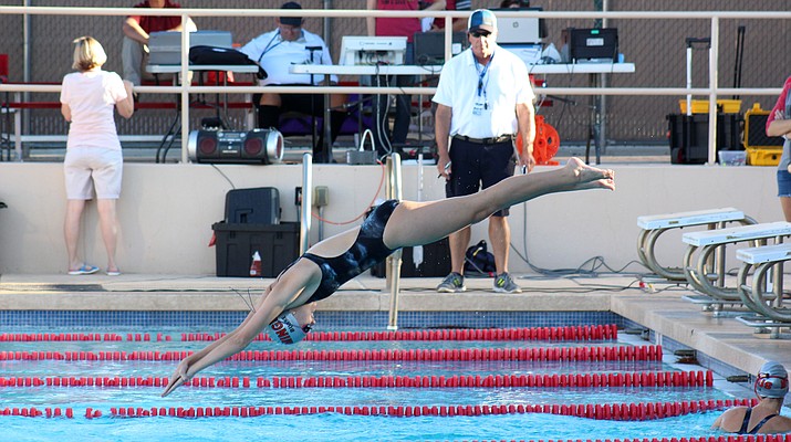 Mingus junior Rylie Burke dives into the pool during a relay against Bradshaw Mountain on Thursday. As of press time, Burke is ranked first in the 50 Free and second in the 100 Free in Division III in the state. (VVN/James Kelley)
