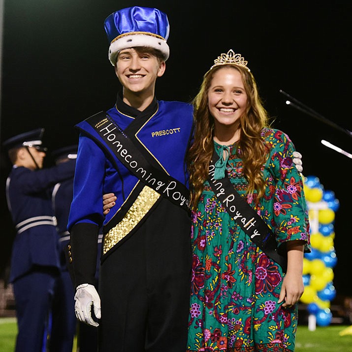 Wesley Bradstreet and Makenna Jex, Prescott High School's 2017 Homecoming King and Queen, pose for the crowd at Friday night’s football game.