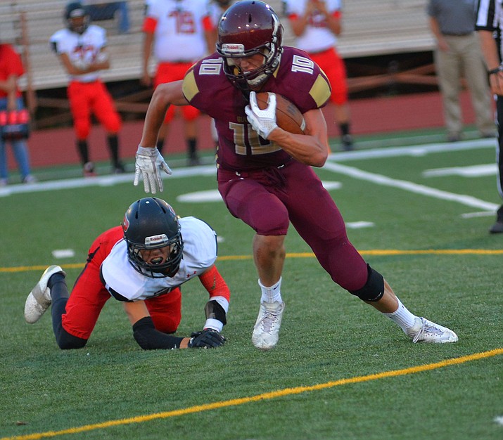 In a previous game against the Page Sand Devils, Jalen Lyons escapes to gain yardage for the Bulldogs .  ToddRoth/NHO
