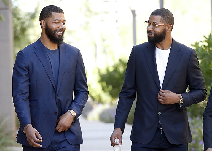 NBA players Markieff, left, and Marcus Morris arrive at Superior Court for the second day of their aggravated assault trial, Tuesday, Sept. 19, 2017, in Phoenix. (Matt York/AP)