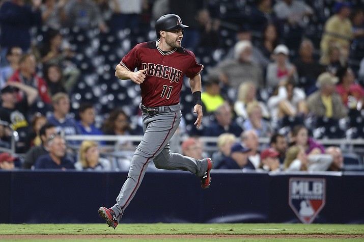 Arizona Diamondbacks’ A.J. Pollock looks back as he heads home on a two-run single by Archie Bradley during the eighth inning of a baseball game against the San Diego Padres on Wednesday, Sept. 20, in San Diego. (Orlando Ramirez/AP)