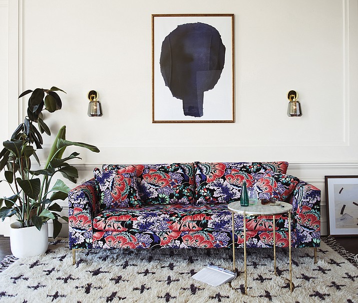 This undated photo provided by Anthropologie shows Liberty of London's Feather Bloom floral print which graces a seating collection this season at Anthropologie. (Anthropologie via AP)