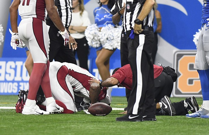Arizona Cardinals running back David Johnson (31) is checked by team trainers for injury against the Detroit Lions during the second half of an NFL football game in Detroit on Sunday, Sept. 10, 2017. (Jose Juarez/AP, File)