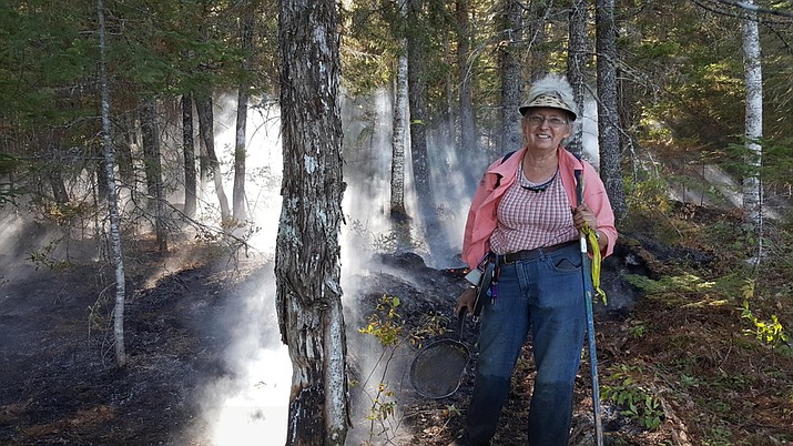 Rangers say Nancy Weeks, armed only with a frying pan, began running back and forth between the flames and a near-by pond, keeping the fire down until crews arrived. (Maine Forest Rangers Photo)