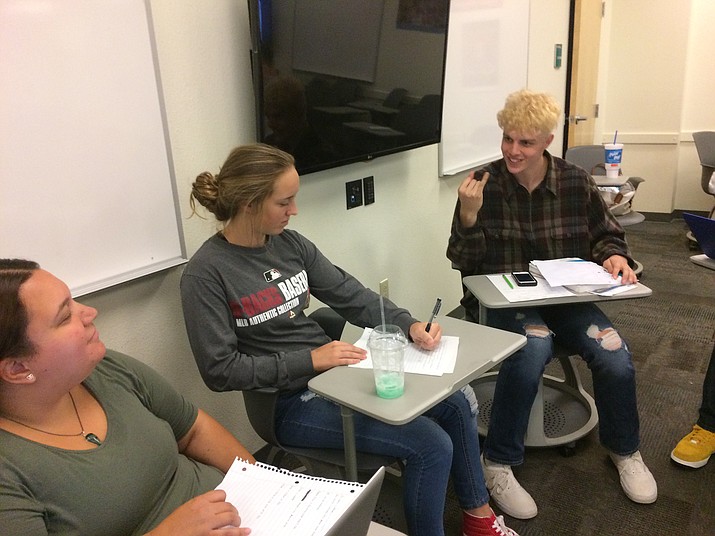PHS senior Kody Jones presents his script in the American Sign Language class he's taking at Yavapai College to fulfill his foreign language requirement. (Nanci Hutson/Courier)