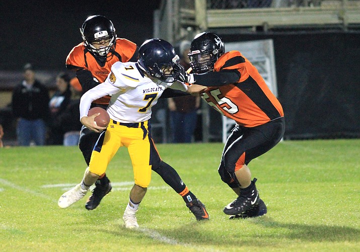 Vikings Emmanuel Flores and Zack Perkins take down the Joseph City Wildcat's quarterback.