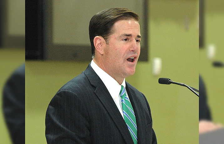 Gov. Doug Ducey explains a new “teacher academy” program on Tuesday that will provide college tuition to some to convince them to go into the classroom.  (Capitol Media Services photo by Howard Fischer)