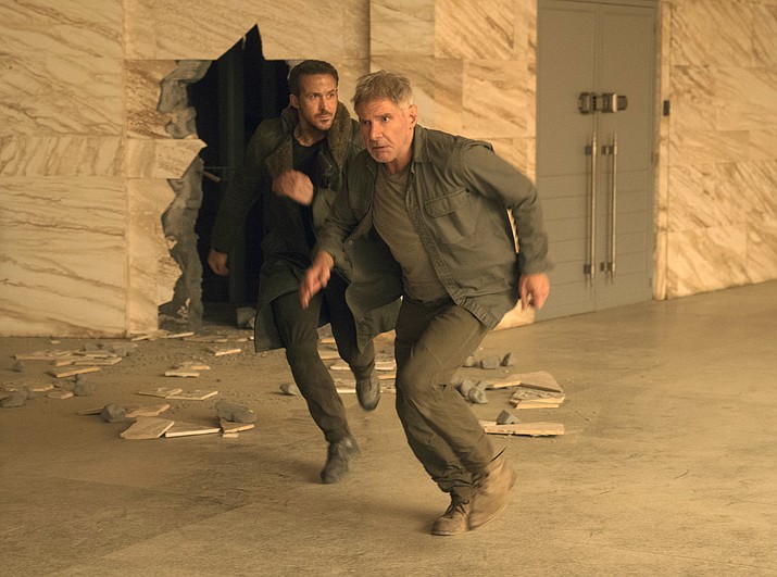 Ryan Gosling, left, and Harrison Ford in a scene from "Blade Runner 2049." (Stephen Vaughan/Warner Bros. Pictures via AP)