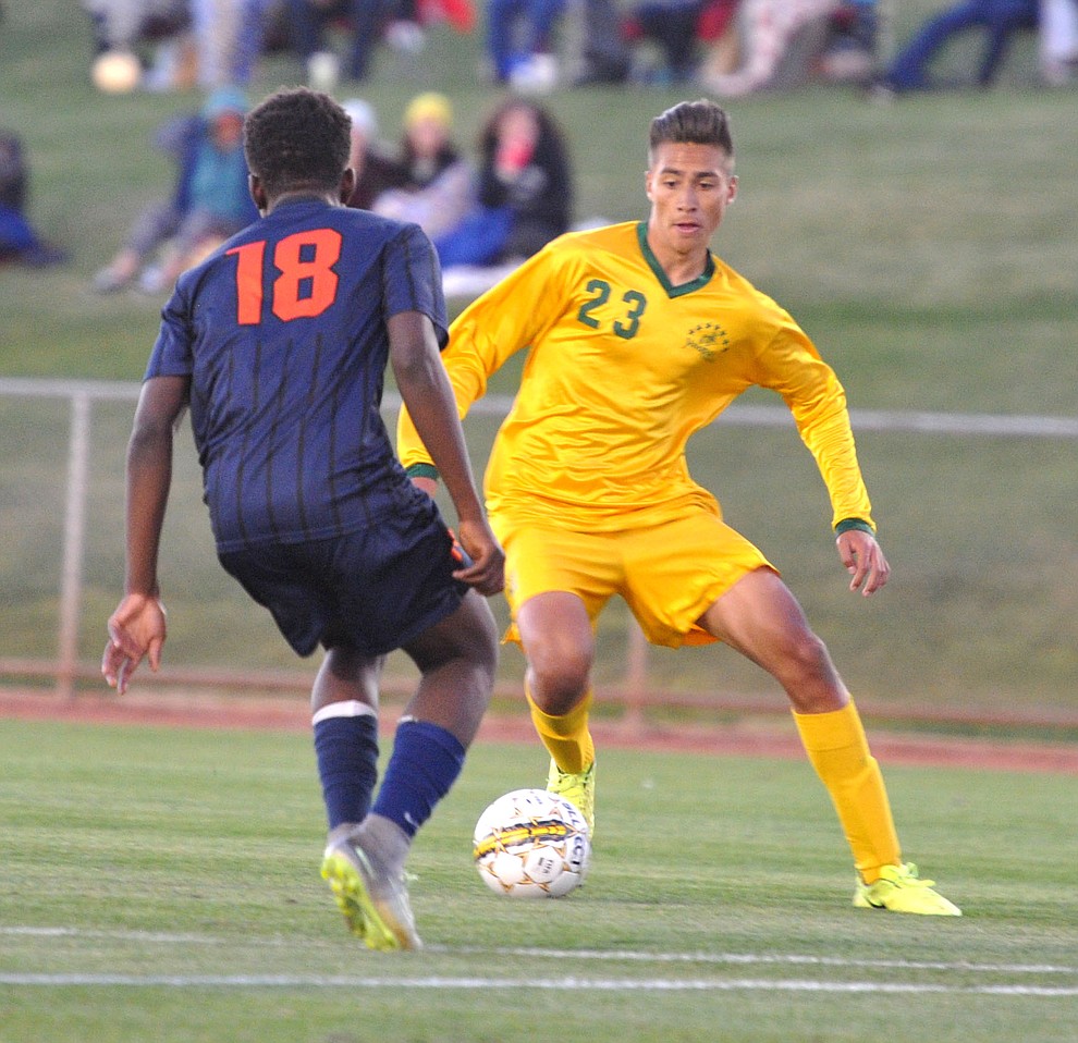 Yavapai's John Scearce (23) maneuvers the ball as the Roughriders take on Pima Community College in soccer Tuesday night in Prescott Valley. (Les Stukenberg/Courier)