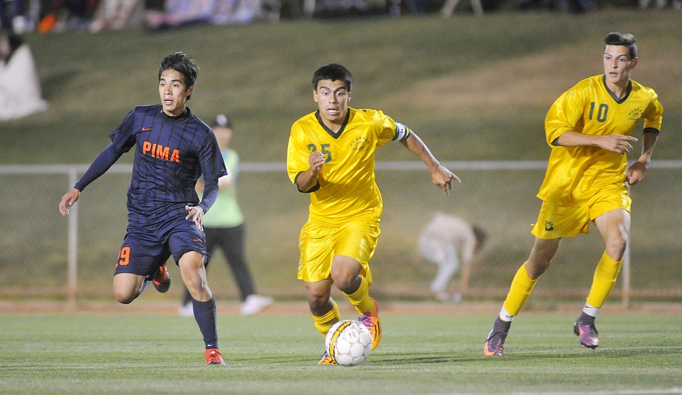 Yavapai's Jose Perez Flores (25) brings the ball toward the box as the Roughriders take on Pima Community College in soccer Tuesday night in Prescott Valley. (Les Stukenberg/Courier)