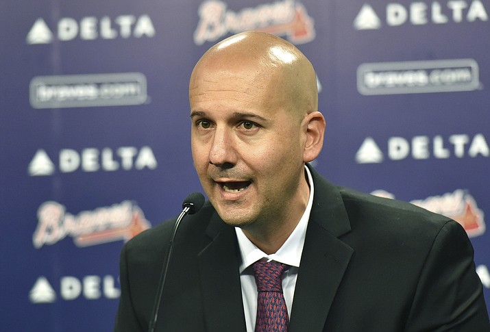 In this Oct. 1, 2015, file photo, Atlanta Braves general manager John Coppolella speaks during a baseball news conference at Turner Field in Atlanta. Coppolella has resigned from his position, the Braves announced on Monday, Oct. 2, 2017 (Hyosub Shin/Atlanta Journal-Constitution via AP, File)