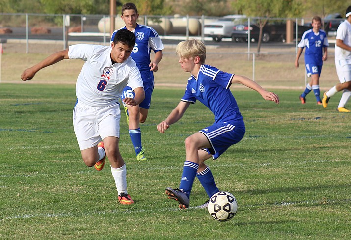 Camp Verde senior Alex Ortiz dribbles past a Northland Prep defender on Sept. 26. Last week at the Old Pueblo Classic, the Cowboys earned draws against No. 2 Blue Ridge and No. 4 Snowflake. (VVN/James Kelley)