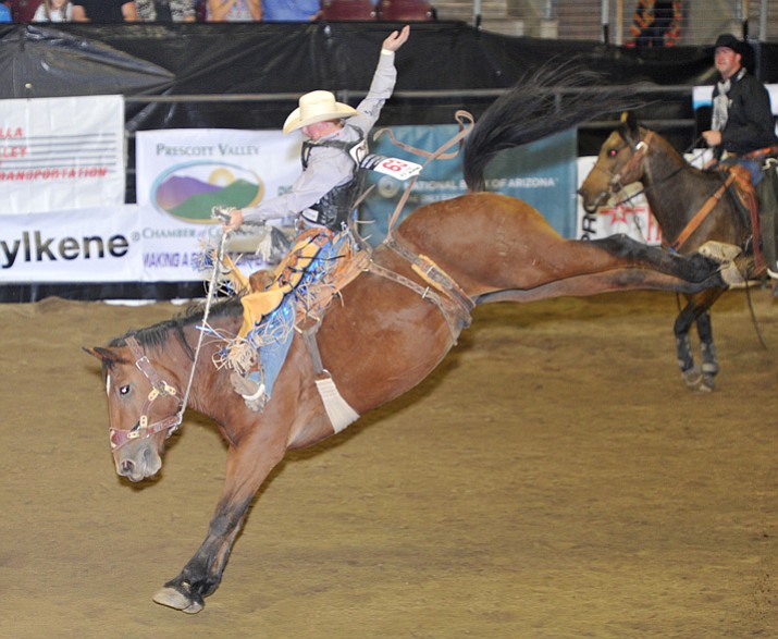 Taos Muncy scored 80.5 on Dakota Babe in the Saddle Bronc Riding to lead during the first round of the Turquoise Circuit Finals Rodeo at the Prescott Valley Event Center on Thursday, Oct. 5. (Les Stukenberg/Courier)